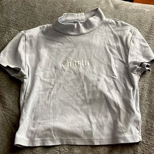 short baby blue turtle neck white lettering